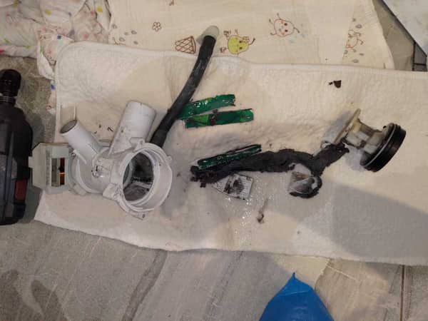 陳小姐收回出租單位驚見西門子洗衣機E06故障碼，排水泵竟藏著爛掉的住戶證 😱